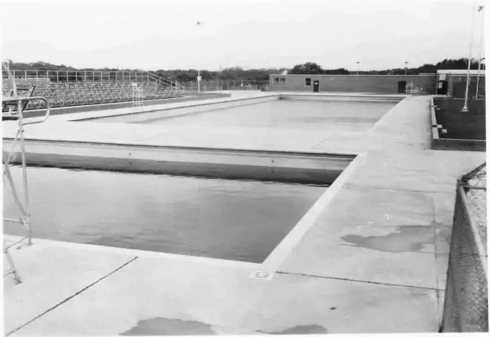 Black-and-white photograph of the newly built Alamo Heights pool in 1948, the empty deck and diving end