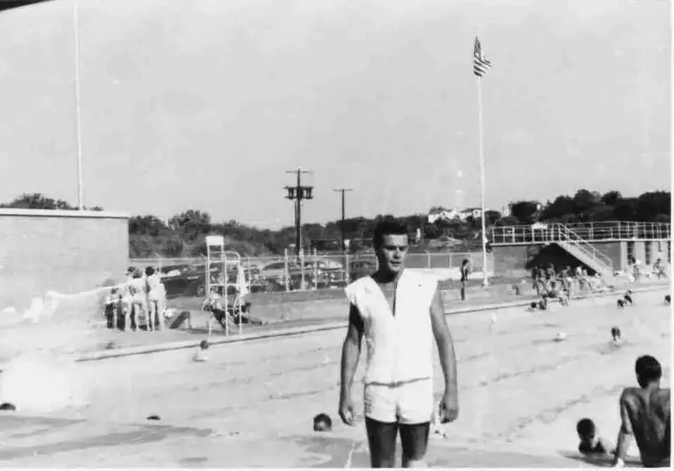 Black-and-white photograph of the poolside in the early years